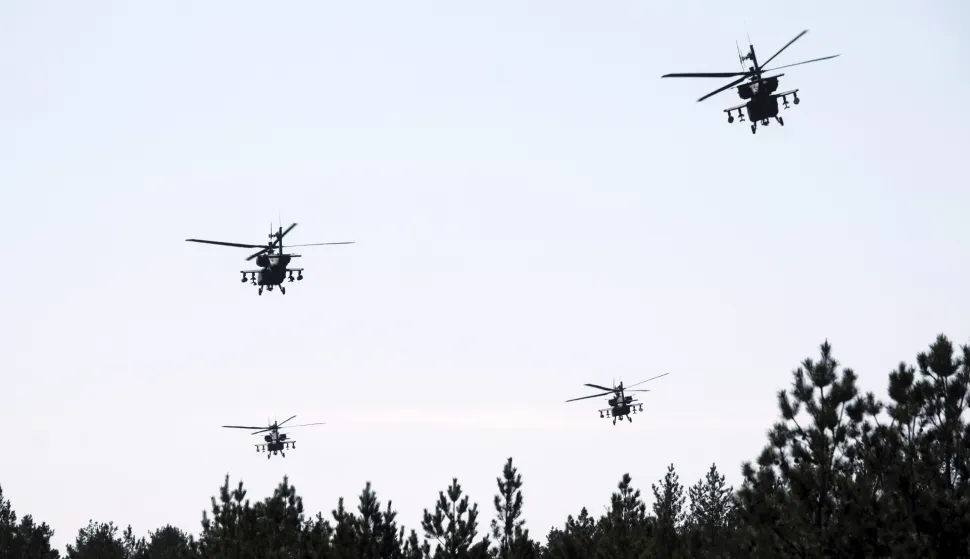 epa12069452 US Army's AH-64D Apache attack helicopters conduct aerial gunnery training at Adazi Military training ground in Latvia, 02 May 2025. During the training, the final stage of the regular certification process also took place which will certify that Apache helicopter crews are capable of conducting combat operations, firing and neutralizing various types of targets &ETH; stationary and moving. EPA/VALDA KALNINA