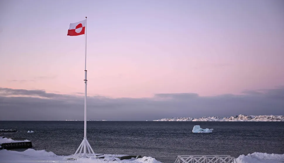(FILES) A Greenlandic flag flutters in the wind in Nuuk, Greenland, on January 20, 2026. EU chief Ursula von der Leyen heads to Greenland on September 6, 2026 for a two-day visit aimed at reaffirming the bloc's support for the Danish autonomous territory coveted by US President Donald Trump. On September 7, 2026, she is to due to sign a joint declaration between the European Union and Greenland. (Photo by Jonathan Nackstrand/AFP)