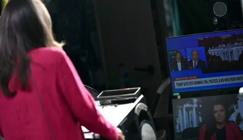 CNN Senior White House Correspondent Kristen Holmes waits to appear on-air from the CNN position on Pebble Beach, where television networks broadcast from the North Lawn of the White House, in Washington, DC, on September 18, 2026. US President Donald Trump said he was banning news outlets CNN, MSNOW and Politico from the White House, accusing them without specifics of reporting "fiction and lies." Trump added that "other Fake News Media Outlets to follow" but did not say which. (Photo by Kent NISHIMURA/AFP)