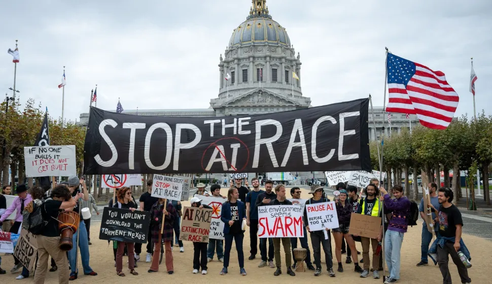 Protesters during a "Stop the AI Race" demonstration calling for a slowdown in the development of advanced artificial intelligence systems outside City Hall in San Francisco, California, on September 17, 2026. The world's biggest AI companies are working on creating a standards body, ChatGPT-maker OpenAI said on September 15, as fears rise about the dangers of AI and pressure is on to create a safer version of the technology. US President Donald Trump has dismissed warnings about the risks of AI as "hoaxes." (Photo by Karl Mondon/AFP)