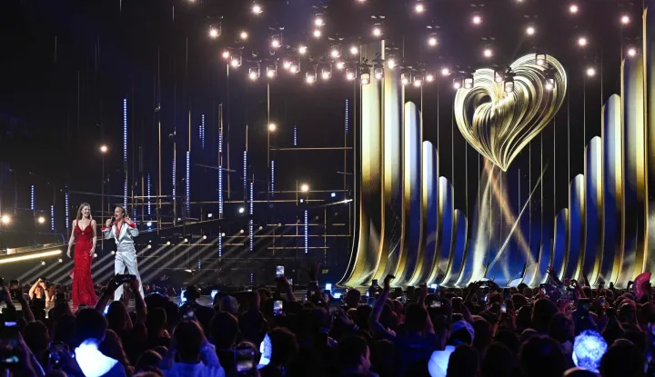 Austrian presenters Victoria Swarovski and Michael Ostrowski arrive on stage for a dress rehearsal for the first semi-final of the Eurovision Song Contest 2026 (ESC) at Wiener Stadthalle in Vienna, Austria on May 11, 2026. (Photo by Tobias SCHWARZ/AFP)