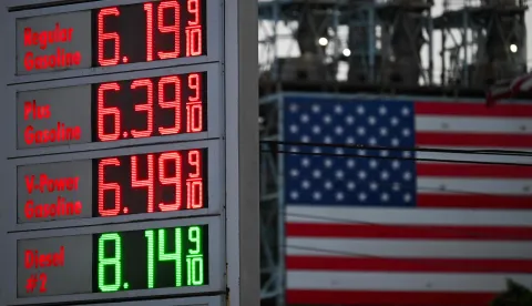 Gas prices at a Shell gas station above  a gallon for regular gasoline and  a gallon for diesel are displayed across from a US flag outside of the Marathon Petroleum Corp. Los Angeles Refinery in Carson, California on September 22, 2026. According to the company?s website, the refinery is the largest on the West Coast with a crude oil capacity of 365,000 barrels per calendar day, producing California Air Resources Board (CARB) gasoline and CARB diesel fuel among other products. (Photo by Patrick T. Fallon/AFP)