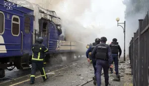 This handout picture taken and released by the Ukrainian State Emergency Service on September 12, 2026 shows firefighters extinguish fire at a train carriage damaged by a drone strike near the border with Poland. Poland and Ukraine condemned on September 13, 2026 an escalation following Russian strikes in Ukraine close to the Polish border, which notably targeted a train bound for Warsaw, which come just a week after visits by US envoys to Moscow and Kyiv aimed at reviving Washington-led negotiations to end the conflict. (Photo by Handout/Ukrainian State Emergency Service/AFP)