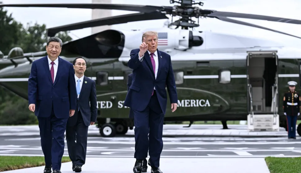 US President Donald Trump walks with China's President Xi Jinping after showing him the new helipad on the South Lawn of the White House after their bilateral meeting, in Washington, DC, on September 24, 2026. President Xi is on a State visit to the United States from September 23 to 25. (Photo by Brendan SMIALOWSKI/AFP)