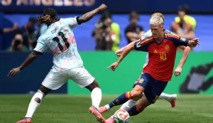 Spain's forward #10 Dani Olmo runs with the ball past Belgium's forward #11 Jeremy Doku during the 2026 World Cup football tournament quarter-final match between Spain and Belgium at the Los Angeles Stadium in Inglewood on July 10, 2026. (Photo by Patrick T. Fallon/AFP)