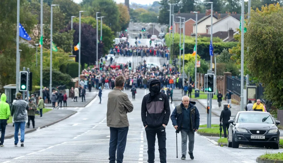 Protesters continue to block the Garvaghy Road in Portadown, Northern Ireland on September 27, 2026, preventing a parade of marchers from the Orange Order using the route through the mainly nationalist area of the town. A parade by Northern Ireland's pro-British Protestant Orange Order was set to pass through a mainly Catholic and nationalist area on Sunday for the first time since 1997, after an overnight court ruling cleared it to proceed. The confrontation is known as the Drumcree dispute after the church attended by the marchers. (Photo by Paul Faith/AFP)