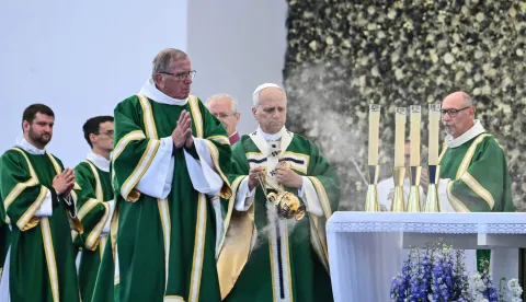 Pope Leo XIV (C) spreads incense as he celebrates a holy mass at the Prairie of the Shrine of Our Lady of Lourdes, southwestern France, on September 27, 2026 on the third day of his visit to France. (Photo by Alberto PIZZOLI/AFP)