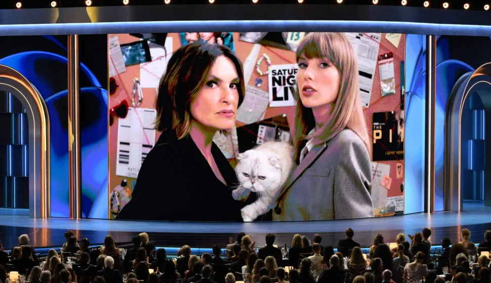 US director Mariska Hargitay and US singer Taylor Swift and her cat Olivia Benson appear on screen during the 78th Primetime Emmy Awards at the Peacock Theatre at LA Live in Los Angeles on September 14, 2026. (Photo by Patrick T. Fallon/AFP)/RESTRICTED TO EDITORIAL USE