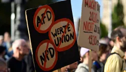 People protest and hold a placards during a rally called by the organizations Campact and Fridays for Future named ?Time to Act: Stop the AfD!" in Berlin on September 7, 2026, one day after regional elections in the eastern federal state of Saxony-Anhalt. (Photo by John MACDOUGALL/AFP)