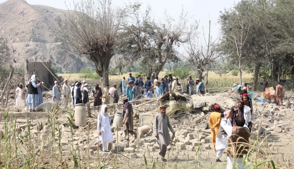 Afghans gather to clear rubble in the aftermath of a Pakistani airstrike in the Nurgal district of Afghanistan's Kunar province on September 21, 2026. Pakistan "bombarded civilian homes" in two eastern provinces of Afghanistan, killing three people, the Taliban government in Kabul said on September 21. (Photo by Aimal ZAHIR/AFP)