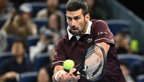 Serbia's Novak Djokovic hits a return to Germany?s Alexander Zverev during their men?s singles quarter-final at the China Open tennis tournament in Beijing on October 4, 2026. (Photo by Pedro PARDO/AFP)