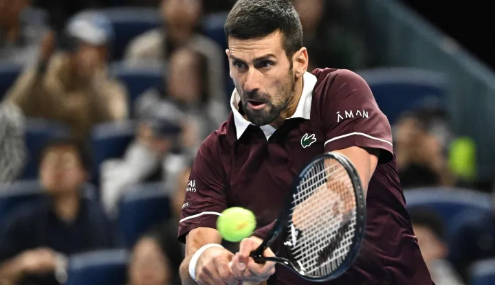 Serbia's Novak Djokovic hits a return to Germany?s Alexander Zverev during their men?s singles quarter-final at the China Open tennis tournament in Beijing on October 4, 2026. (Photo by Pedro PARDO/AFP)