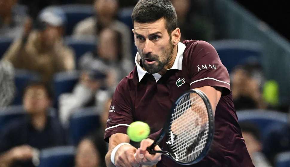 Serbia's Novak Djokovic hits a return to Germany?s Alexander Zverev during their men?s singles quarter-final at the China Open tennis tournament in Beijing on October 4, 2026. (Photo by Pedro PARDO/AFP)