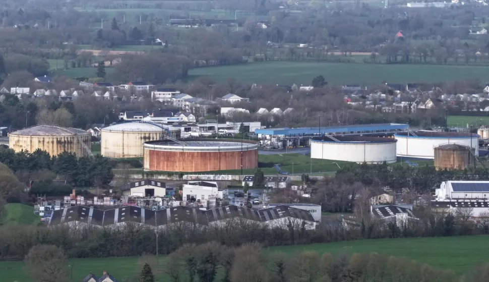 (FILES) This aerial photograph shows oil storage tanks at a deposit in Vern-sur-Seiche, western France, on March 11, 2026. G7 countries have agreed to release "100 million barrels" of diesel and crude oil from their reserves over the next four months, their leaders said on October 2, 2026. The nations agreed to "a coordinated release through the IEA of 100 million barrels to begin immediately over four months," they said in a statement released by French President Emmanuel Macron's office after talks to coordinate action on fuel prices. (Photo by Damien MEYER/AFP)