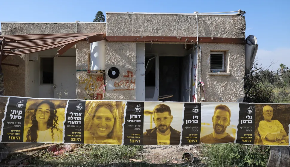 epa11264178 Pictures are displayed of Israeli hostages held by Hamas in Gaza since the October 07 attack in Kibbutz Kfar Aza, near the border with Gaza in southern Israel, 07 April 2024. Israel marks six months since the October 07 attack. According to Israeli IDF 134 israeli hostages are being held by Hamas in Gaza. EPA/ABIR SULTAN