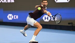Serbia?s Novak Djokovic hits a return to Russia?s Daniil Medvedev during their men?s singles semi-final at the China Open tennis tournament in Beijing on October 5, 2026. (Photo by Greg Baker/AFP)