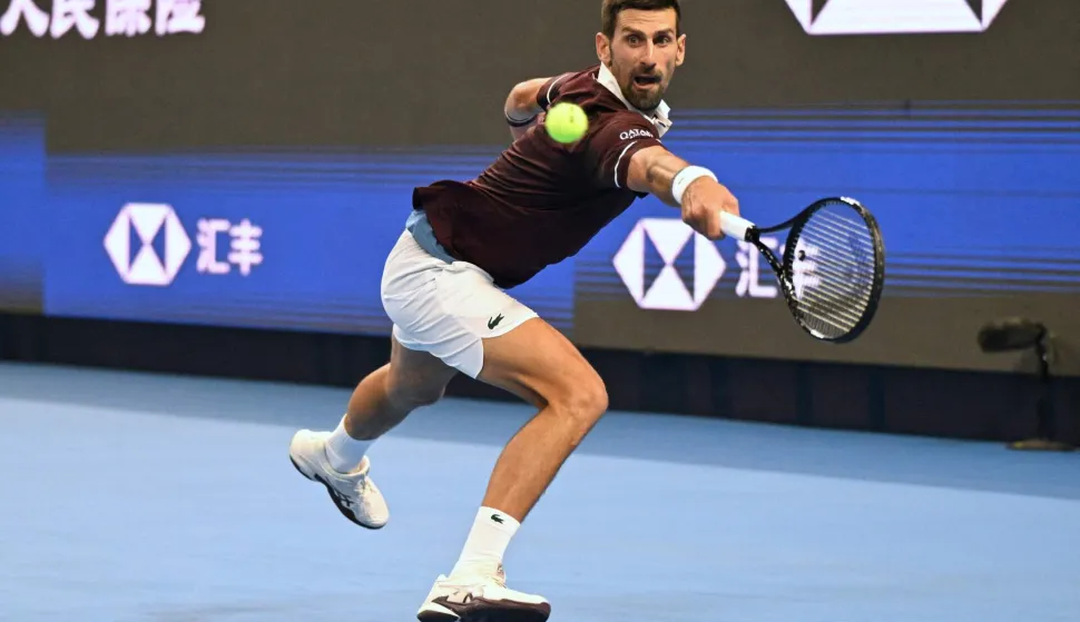 Serbia?s Novak Djokovic hits a return to Russia?s Daniil Medvedev during their men?s singles semi-final at the China Open tennis tournament in Beijing on October 5, 2026. (Photo by Greg Baker/AFP)