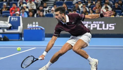 Serbia?s Novak Djokovic hits a return to Russia?s Daniil Medvedev during their men?s singles semi-final at the China Open tennis tournament in Beijing on October 5, 2026. (Photo by GREG BAKER/AFP)