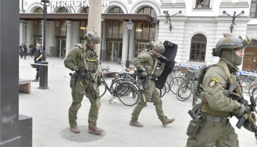 epa05894814 Police officers outside Stockholm Central station in Stockholm, Sweden, 07 April 2017. Three people were killed when a truck crashed into department store Ahlens on Drottninggatan, in central Stockholm, 07 April 2017. EPA/JESSICA GOW SWEDEN OUT