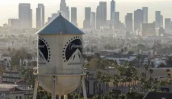 LOS ANGELES, CALIFORNIA - OCTOBER 06: In an aerial view, the Paramount logo is displayed on a water tower at the Paramount Studios lot on October 06, 2026 in Los Angeles, California. Paramount Skydance completed its 0 billion acquisition of Warner Bros. Discovery, creating a new global entertainment company called Skydance that combines major film studios, streaming services Paramount+ and HBO Max, and news networks CBS and CNN. Justin Sullivan/Getty Images/AFP (Photo by JUSTIN SULLIVAN/GETTY IMAGES NORTH AMERICA/Getty Images via AFP)