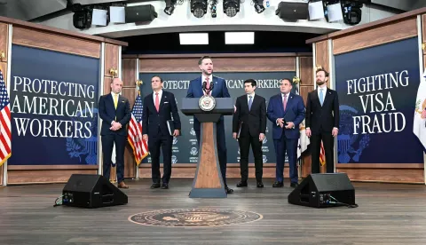 US Vice President JD Vance speaks speaks alongside (L-R) White House Deputy Chief of Staff and Homeland Security Advisor Stephen Miller, US Attorney General Todd Blanche, US Labor Secretary Keith Sonderling, Inspector General of the US Department of Labor Anthony D'Esposito and Federal Trade Commission (FTC) Chair Andrew Ferguson during a press conference to provide an update in the federal investigation and crackdown regarding fraud and abuse of the H-1B visa program in Washington, DC, on October 8, 2026. (Photo by Alex WROBLEWSKI/AFP)