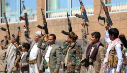 Fighters loyal to the Houthi authorities, take part in a rally to recruit more fighters, in Sanaa on October 7, 2026. The Houthis claimed a flurry of attacks on Saudi targets on October 7 including firing a ballistic missile at Riyadh airport, as the group battles for territory in Yemen against government forces supported by the kingdom. (Photo by Mohammed HUWAIS/AFP)