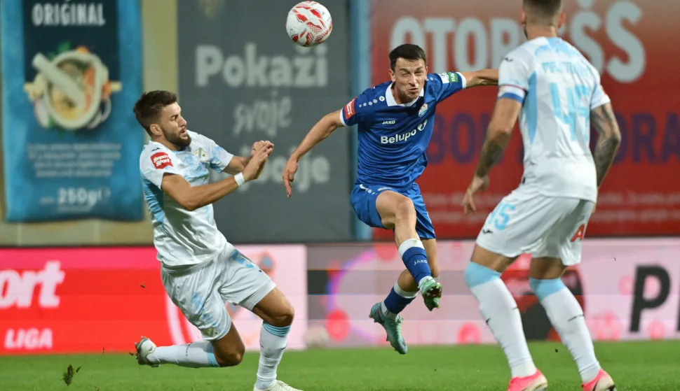 11.10.2026., stadion Ivan Kusek Apas, Koprivnica - SuperSport HNL 2026./2027., 09. kolo, NK Slaven Belupo - HNK Rijeka. Anel Husic i Lovro Banovec Photo: Vjeran Zganec Rogulja/PIXSELL