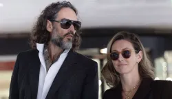 British comedian and actor Russell Brand and his wife Laura leave after jury selection finishes at the start of his trial at Southwark Crown Court in south London on October 12, 2026, after pleading not guilty to three charges of rape, indecent assault, and three counts of sexual assault. (Photo by Brook Mitchell/AFP)
