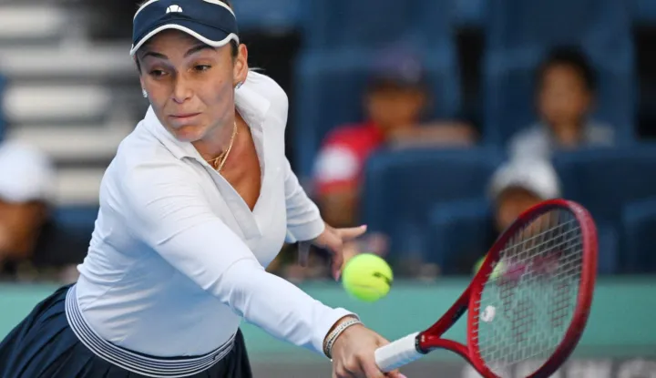 Croatia?s Donna Vekic hits a return to Poland?s Iga Swiatek during their women's singles match at the China Open tennis tournament in Beijing on October 5, 2026. (Photo by GREG BAKER/AFP)