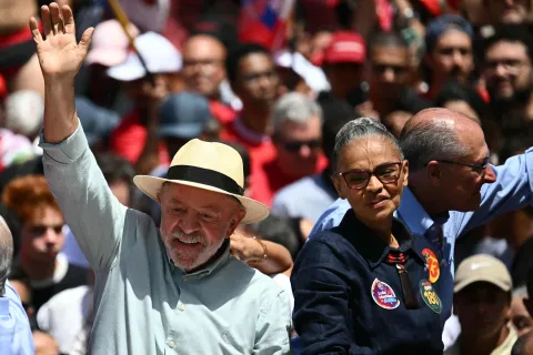 Brazil's President and presidential candidate Luiz Inacio Lula da Silva (L) waves next to the Minister of the Environment Marina Silva, and Vice-President Geraldo Alckmin (R), during a campaign rally on the eve of the general election, in Sao Paulo, Brazil on October 3, 2026. Brazilians go to the polls on October 4, 2026, in a tight race led by leftist President Luiz Inacio Lula da Silva and right-wing senator Flavio Bolsonaro, son of imprisoned former president Jair Bolsonaro. (Photo by Luis ROBAYO/AFP)