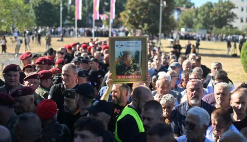 Mourners, holding a portrait of late Bosnian Serb military leader Ratko Mladic, queue as they arrive to take part in a public memorial on the day of his funeral ceremony at St Lukas church in Belgrade, on September 7, 2026. Mladic, 84, died last week after suffering several strokes while serving a life sentence in The Hague for war crimes committed during the 1990s war in Bosnia. (Photo by OLIVER BUNIC/AFP)