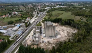 Aerial view shows the former PPK Velebit agro-food industrial complex and its silo where waste was illegally dumped and buried in Gospic, Croatia's Lika region, on September 21, 2026. As Croatia prepares to clean up tens of thousands of tonnes of hazardous waste dumped in the heart of its idyllic Lika region, locals fear years of illegal dumping may have spread into its pristine surrounds. (Photo by MARKO PERKOV/AFP)