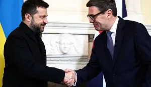 Britain's Prime Minister Andy Burnham (R) shakes hands with Ukraine's President Volodymyr Zelensky during a meeting at 10 Downing Street, in central London, on October 14, 2026. (Photo by Henry Nicholls/POOL/AFP)