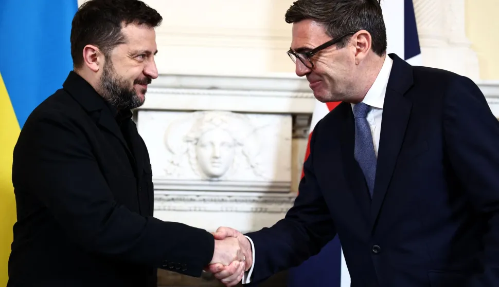 Britain's Prime Minister Andy Burnham (R) shakes hands with Ukraine's President Volodymyr Zelensky during a meeting at 10 Downing Street, in central London, on October 14, 2026. (Photo by Henry Nicholls/POOL/AFP)