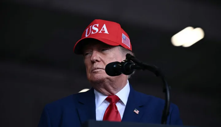 US President Donald Trump speaks at a midterm campaign rally at Dalton Municipal Airport in Dalton, Georgia, on October 16, 2026. Trump is campaigning for US Representative Mike Collins for US Senate and Rick Jackson for governor. (Photo by Brendan SMIALOWSKI/AFP)