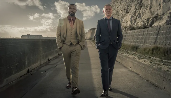 TALL STORY PICTURES FOR ITV AND ITVXGRACE SERIES 6EPISODE 1LEFT YOU DEADPictured JOHN SIMM as DS Roy Grace and RICHIE CAMPBELL as DS Branson.This image is under copyright and can only be reproduced for editorial purposes in your print or online publication. This image cannot be syndicated to any other third party.For further information please contact:Patrick.smith@itv.com 07909906963