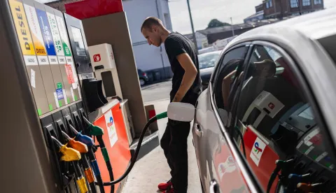 (FILES) A motorist fills his car at a Total Energies petrol station in Faches-Thumesnil near Lille, northern France on August 10, 2023. TotalEnergies commits to lowering the price of a liter of off-road diesel by 20 cents according to CEO of TotalEnergies Patrick Pouyanne. (Photo by Sameer Al-DOUMY/AFP)