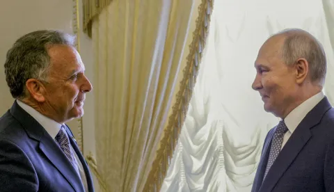 In this pool photograph distributed by the Russian state agency Sputnik, Russia's President Vladimir Putin (R) greets US special envoy Steve Witkoff (L) during their meeting in Saint Petersburg on October 21, 2026. (Photo by Gavriil GRIGOROV/POOL/AFP)/Editor's note: This image is distributed by the Russian state owned agency Sputnik