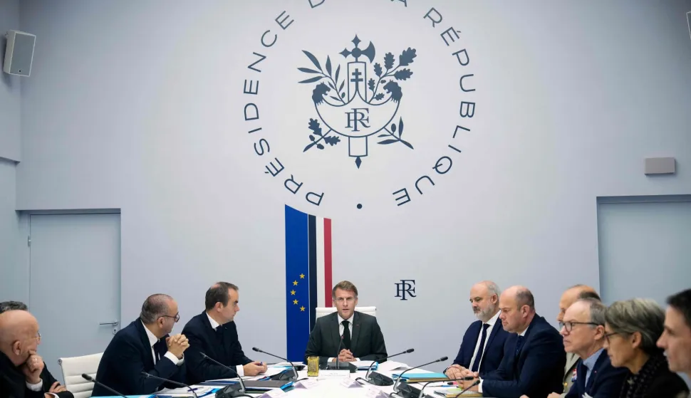 France's President Emmanuel Macron (C), next to France's Interior Minister Laurent Nunez (L) and France's Prime Minister Sebastien Lecornu (2nd-L), chairs a security council gathering Prime Minister, relevant ministers, and intelligence agencies to review "security measures for the coming weeks" as France braced for more demonstrations just days after student and other rallies degenerated into some of the worst street unrest in years, at the Elysee presidential Palace in Paris on October 22, 2026. Emmanuel Macron on October 22, 2026 denounced "seditious acts" by "ultra-left" groups of "extreme dangerousness" aimed at "bringing down the Republic" and "acts of delinquency" also calling for "the greatest severity", in the violence and looting committed on the sidelines of protests against the "high cost of living" on October 17, 2026. (Photo by Teresa Suarez/POOL/AFP)