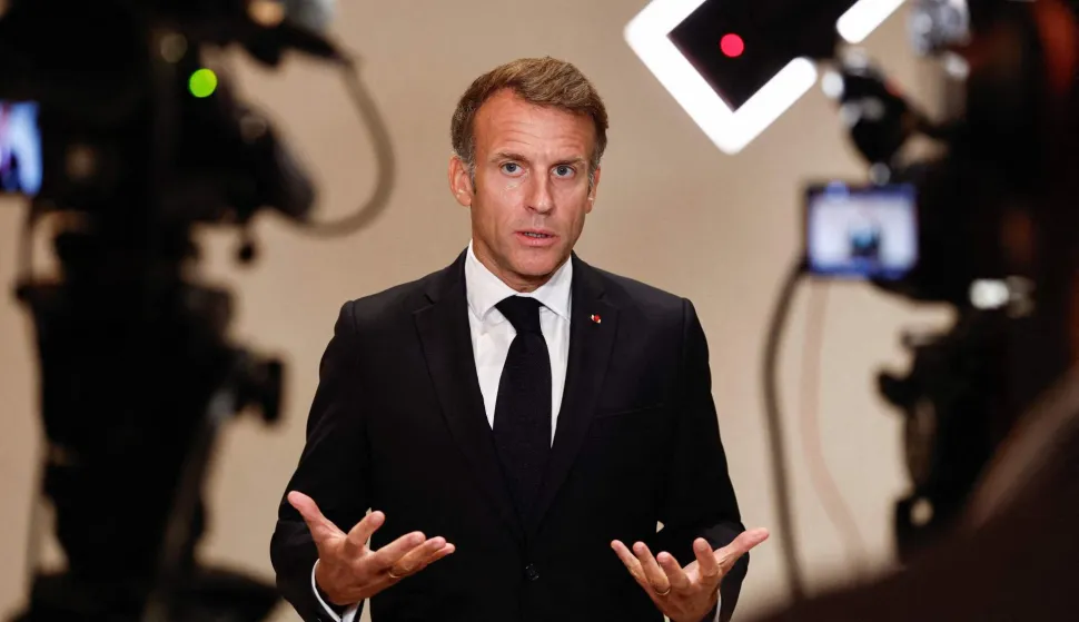 France's President Emmanuel Macron speaks to members of the media on the day of the 9th Annual One Planet Sovereign Wealth Funds (OPSWF) Summit in Lusail on October 21, 2026. The French president is undertaking a tour of key energy suppliers in the Gulf in an effort to secure oil and diesel and bring down prices in France. (Photo by Benoit Tessier/POOL/AFP)