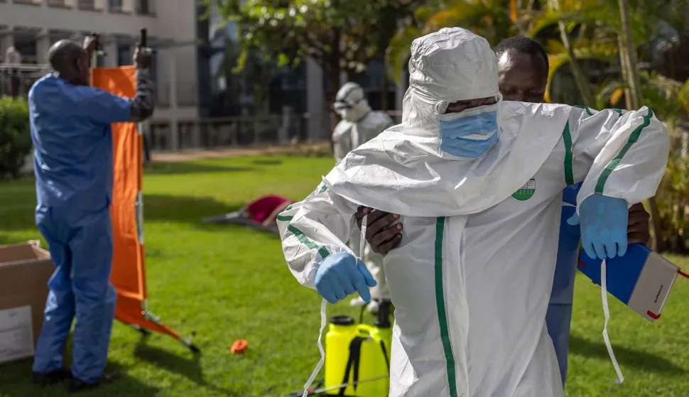 Kenya Red Cross personnel don their Personal Protective Equipment (PPE) during a simulation of evacuating the remains of an Ebola victim in the Kenyan capital Nairobi on October 22, 2026. Kenyan authorities detected a ninth case of Ebola in the country, the health ministry said Tuesday, with a first case reported on October 6 -- a businessman in his forties who had lived in the Democratic Republic of Congo (DRC), where there has been a major outbreak since May. Since the first, eight additional cases have emerged, mostly people with a close connection to the first victim, who died in the capital Nairobi on October 5. (Photo by Tony KARUMBA/AFP)