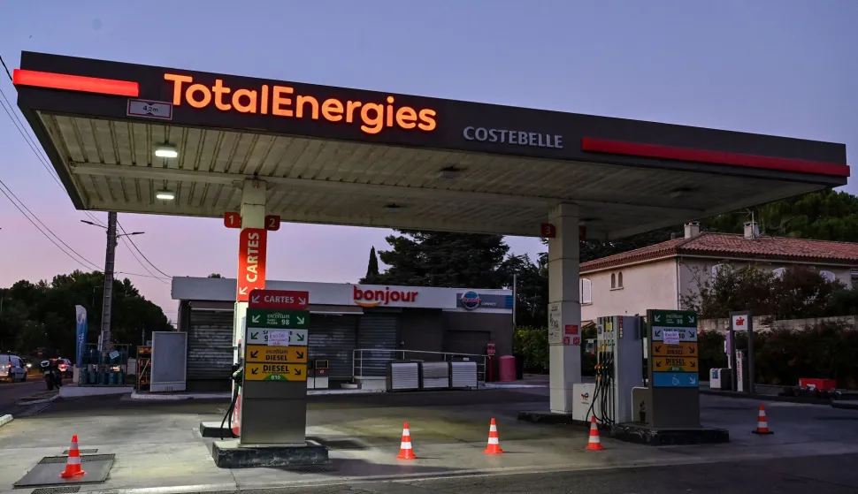 (FILES) Signs which read in French as "out of service" are seen at a closed TotalEnergies petrol station in Montpellier, southern France, on October 4, 2022. TotalEnergies commits to lowering the price of a liter of off-road diesel by 20 cents according to CEO of TotalEnergies Patrick Pouyanne. (Photo by Pascal GUYOT/AFP)