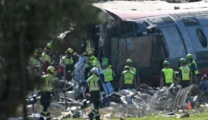 Emergency services work at the site of a train crash between a high speed Renfe AVE train and Iryo train around 150kms south of Madrid between Urda and Los Yebenes in the province of Toledo, on October 28, 2026. (Photo by Javier SORIANO/AFP)