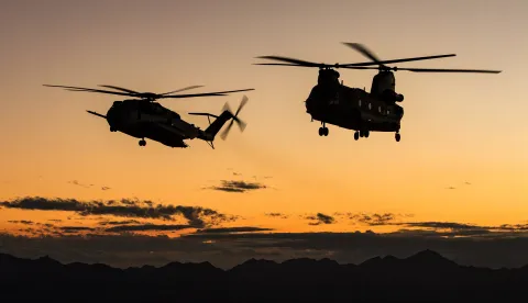 epa07095459 A handout picture provided by the British Ministry of Defence (MOD) showing aRoyal Air Force CH-47 Chinook flying with a USMC CH-53 Sea Stallion during a twilight training sortie in Arizona, USA, 13 October 2018, (issued 15 October 2018). The MOD report that two Royal Air Force Chinook CH-47 helicopters from 27 Sqn, RAF Odiham located in Hampshire, Britain have deployed to Marine Corps Air Station Yuma in Arizona, USA to take part in a twice-a-year training a development programme known as WTI. WTI stands for Weapons and Tactics Instructor, and is a course that aims to develop aircrew - both pilots and NCO's - to an instructional level. It is conducted in the Marine Aviation Weapons and Tactics Squadron One (MAWTS-1) building.Following completion of this, they will then be able to transfer and disseminate these skills to those in their chain of command. Not only are the aircrew trained to instructional level, but they are also able to practise and develop niche skillsets that would normally only be developed in active conflics. An example of this is deploying to a Forward Arming and Refueling Point (FARP) in order to provide rapid refueling and arming to other air and land assets in remote locations, often far from their main operating base. EPA/CPL TIM LAURENCE /BRITISH MINISTRY OF DEFENCE/HANDOUT MANDATORY CREDIT CPL TIM LAURENCE MOD: CROWN COPYRIGHT HANDOUT EDITORIAL USE ONLY/NO SALES