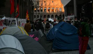 Protesters block a street with tents in front of the Colosseum during a demonstration, part of a nationwide day of strikes and protests as school and university students demand more funding for schools and support for housing, in Rome on October 30, 2026. Students have been protesting for weeks, setting up tent camps and occupying schools to make their demands heard, matching similar movements across the border in France. The Italian protests have taken place alongside those of truck drivers and farmers over the spike in fuel prices and the cost of living, as well as rising defence spending. (Photo by Filippo MONTEFORTE/AFP)