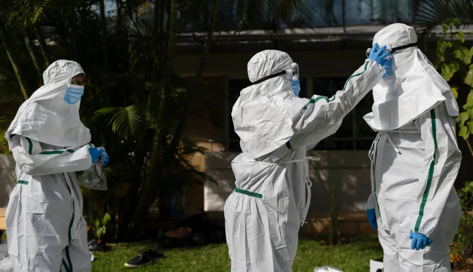 Kenya Red Cross personnel don their Personal Protective Equipment (PPE) during a simulation of evacuating the remains of an Ebola victim in the Kenyan capital Nairobi on October 22, 2026. Kenyan authorities detected a ninth case of Ebola in the country, the health ministry said Tuesday, with a first case reported on October 6 -- a businessman in his forties who had lived in the Democratic Republic of Congo (DRC), where there has been a major outbreak since May. Since the first, eight additional cases have emerged, mostly people with a close connection to the first victim, who died in the capital Nairobi on October 5. (Photo by Tony KARUMBA/AFP)