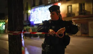A police officer puts in place a perimeter tape near Chatelet - Les Halles to enforce a curfew, in Paris on October 20, 2026, after weekend demonstrations over soaring prices degenerated into some of the worst street violence in recent years. Paris police ordered a new curfew for parts of the city for October 20, after a curfew on the previous night that authorities said resulted in calm being restored following weekend riots and looting. The fresh curfew runs from 2100 GMT on October 20, 2026 to 0400 GMT October 21, 2026 and applies to the Republique public square in the city's central east, where many weekend clashes took place, and in the central les Halles district which is full of shops as well as nearby train stations. (Photo by SIMON WOHLFAHRT/AFP)