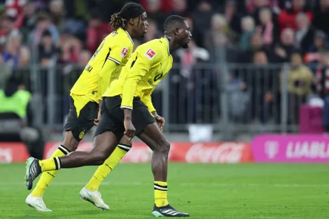 Dortmund's Guinean forward #09 Serhou Guirassy (R) celebrates scoring the 1-1 goal with his teammate Dortmund's Austrian midfielder #17 Carney Chukwuemeka during the German first division Bundesliga football match between FC Bayern Munich and BVB Borussia Dortmund in Munich, southern Germany, on October 31, 2026. (Photo by Alexandra BEIER/AFP)/DFL REGULATIONS PROHIBIT ANY USE OF PHOTOGRAPHS AS IMAGE SEQUENCES AND/OR QUASI-VIDEO